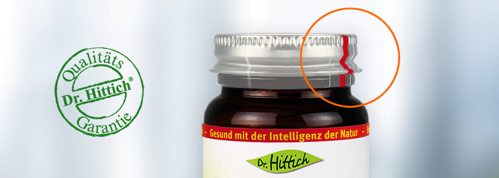 Dr. Hittich Glas mit silberfarbenem Metall-Drehverschluss und hermetische Versiegelung. Nebenan Qualitäts-Garantie Siegel